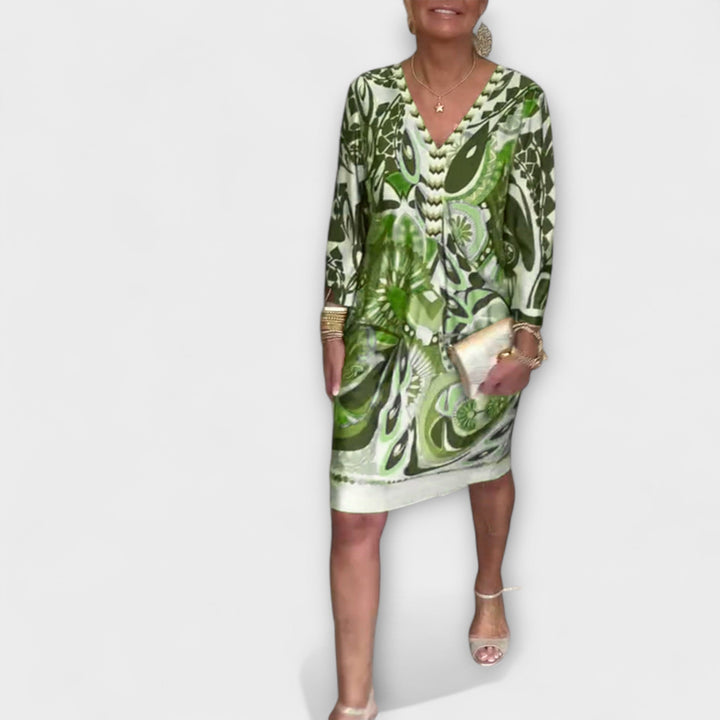 V-hals uvolněné šaty s retro potiskem