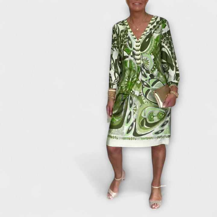 V-hals uvolněné šaty s retro potiskem