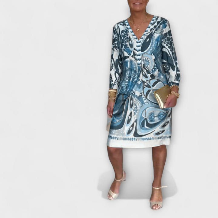 V-hals uvolněné šaty s retro potiskem